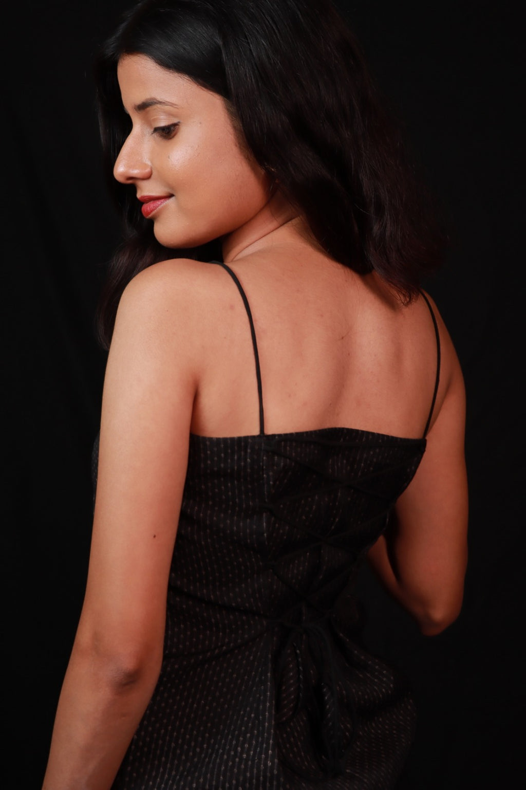dark coloured spaghetti-strap top with