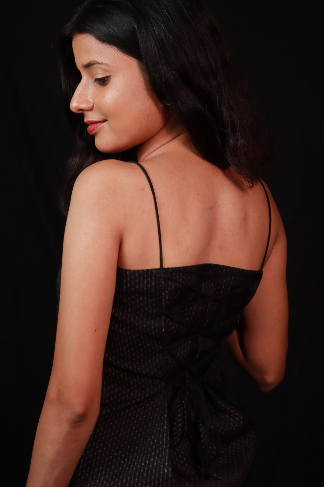 dark coloured spaghetti-strap top with
