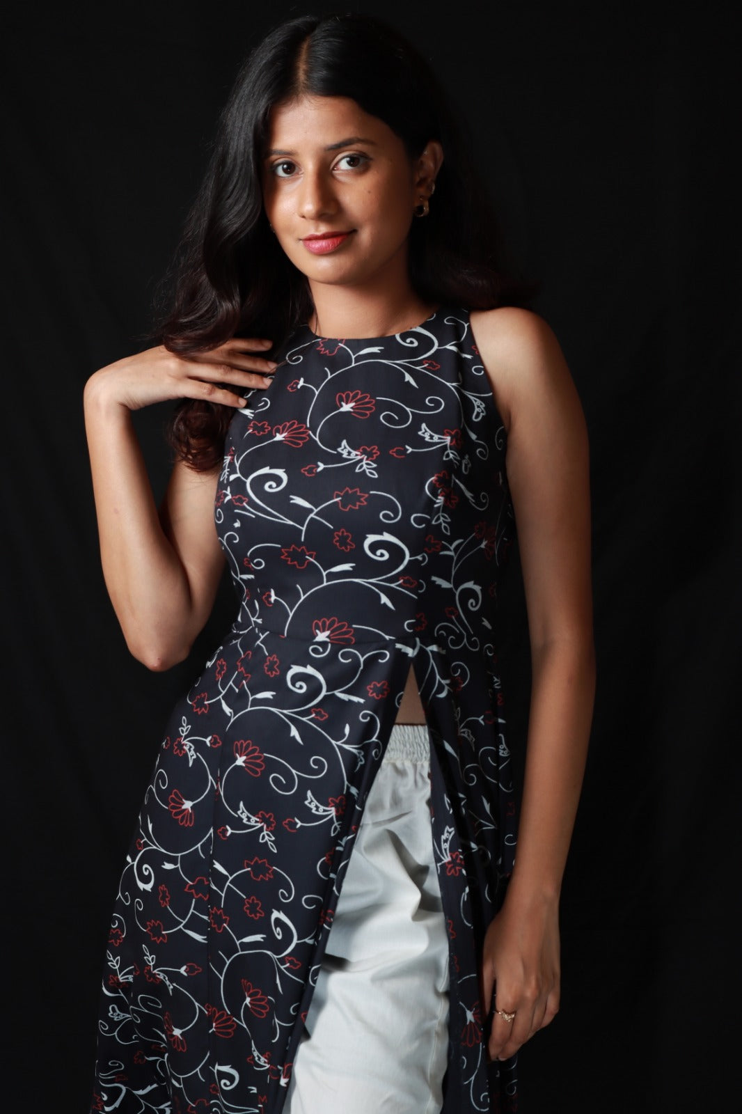 Patterned long kurta with side slit worn over with wide legged white pants